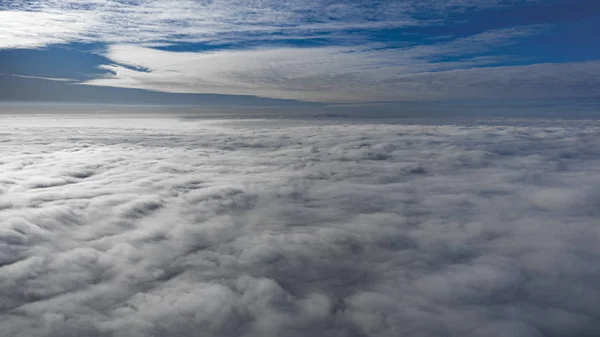 Yellow and blue dawn over clouds, concept, travel and leisure. — Stock Photo, Image