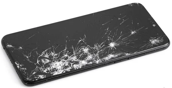 Bruten svart smartphone på en vit bakgrund — Stockfoto