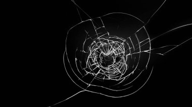 Siyah arkaplanda camda yuvarlak beyaz çatlaklar.