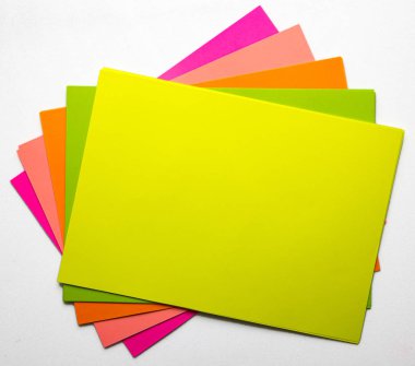 Color paper samples on a white background