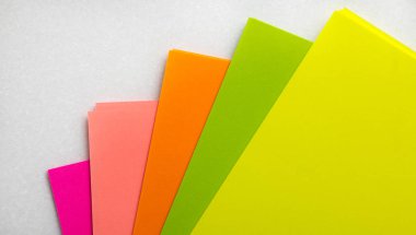 Color paper samples on a white background