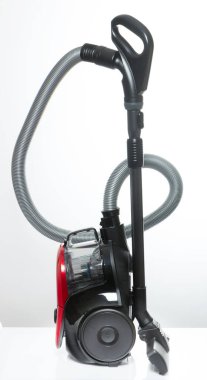 Black and red vacuum cleaner on a white background