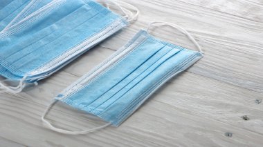 Blue medical mask on a white background. Coronavirus protection