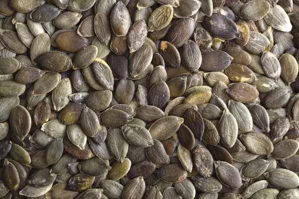 Natural background, texture of Pumpkin seeds. Close-up — Stok fotoğraf