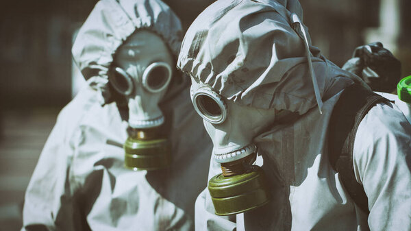 Two workers disinfecting teams. in military protective suits on the street.