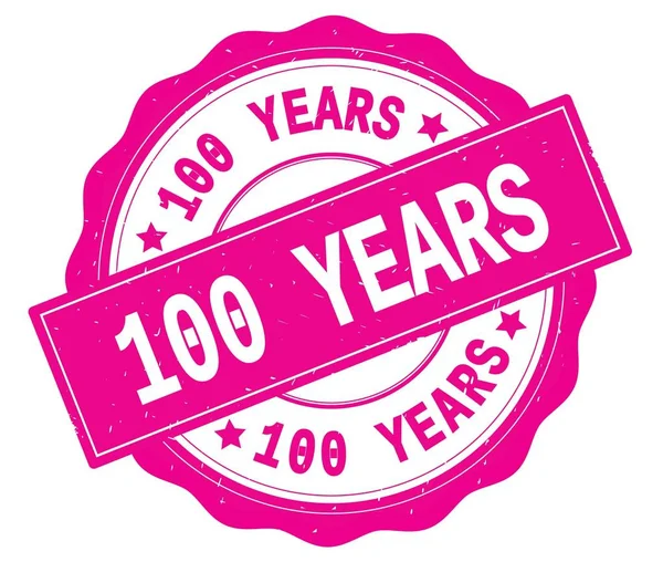 100 YEARS text, written on pink round badge. — ストック写真