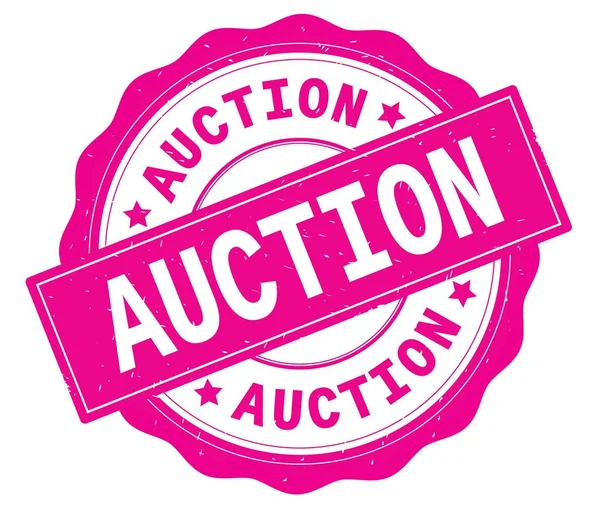 AUCTION text, written on pink round badge. — Stock Photo, Image