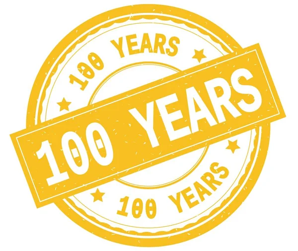 100 jaar, geschreven tekst op gele ronde rubber stamp. — Stockfoto