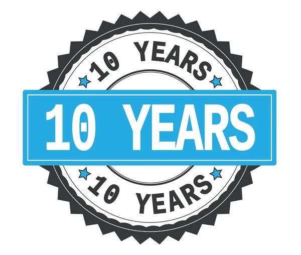 10 YEARS text on grey and cyan round stamp, with zig zag border. — Stock Photo, Image