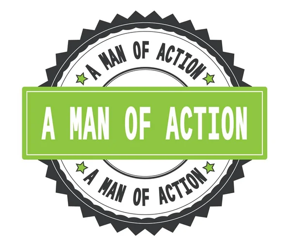 A MAN OF ACTION text on grey and green round stamp, with zig zag