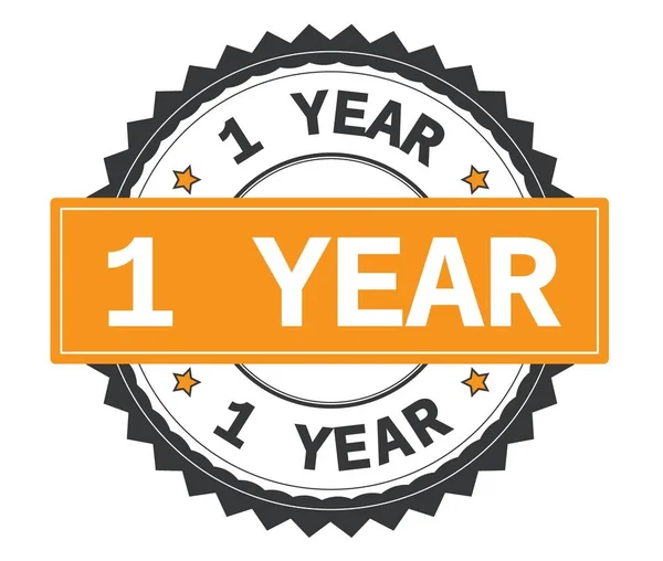 1 YEAR text on grey and orange round stamp, with zig zag border. — Stock Photo, Image