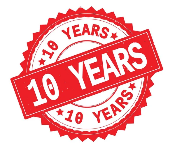 10 YEARS red text round stamp, with zig zag border. — Stock Photo, Image