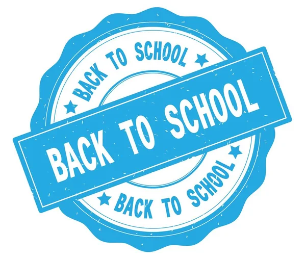 BACK TO SCHOOL text, written on cyan round badge. — Stock Photo, Image