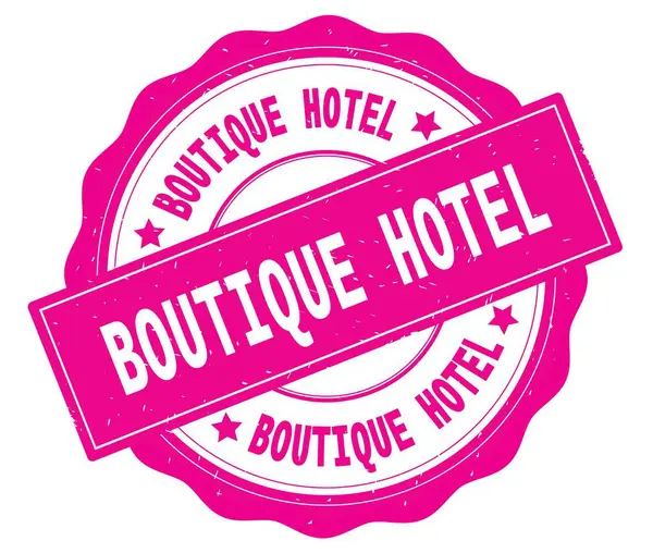 Boutique Hotel szöveg, a rózsaszín kerek jelvény. — Stock Fotó