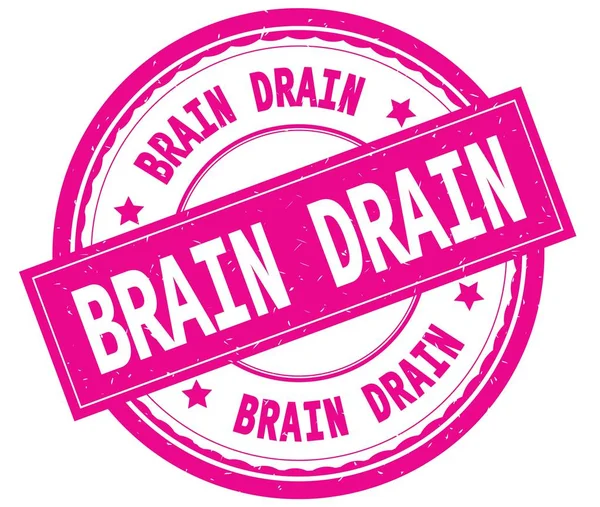 BRAIN DRAIN, written text on pink round rubber stamp . — стоковое фото