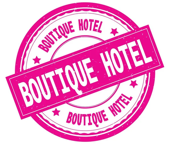 BOUTIQUE HOTEL, texte écrit sur tampon caoutchouc rond rose . — Photo