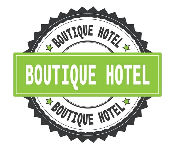 BOUTIQUE HOTEL texte sur timbre rond gris et vert, avec zig zag — Photo