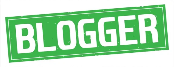 BLOGGGER text, on full green rectangle stamp . — стоковое фото