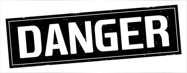 Tam siyah dikdörtgen damga üzerinde tehlike metin.