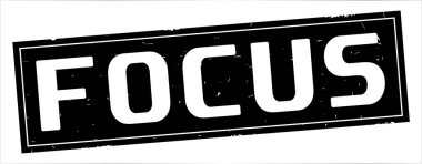 Tam siyah dikdörtgen damga üzerinde odak metin.