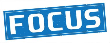 Tam mavi dikdörtgen damga üzerinde odak metin.