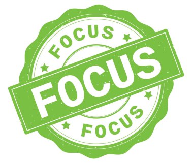 Odağı metin, yeşil yuvarlak rozet yazılmış.