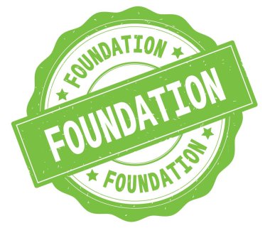 Yeşil yuvarlak rozet yazılmış Vakfı metni,.