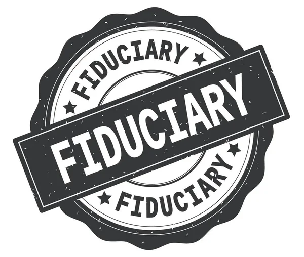 Gri yuvarlak rozet yazılmış Mütevelli metni.