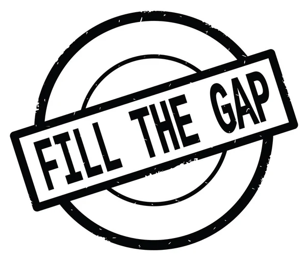 FILL THE GAP text, written on black simple circle stamp.