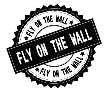 Fly On The Wall siyah metin damgası, zig zag kenarlıklı yuvarlak.