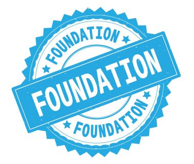 Vakfı mavi metin damgası, zig zag kenarlıklı yuvarlak.