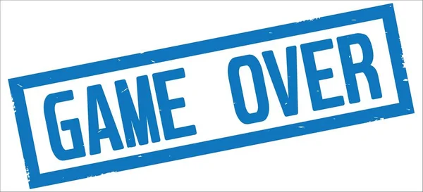 Текст GAME OVER, на синем прямоугольном камуфляже . — стоковое фото