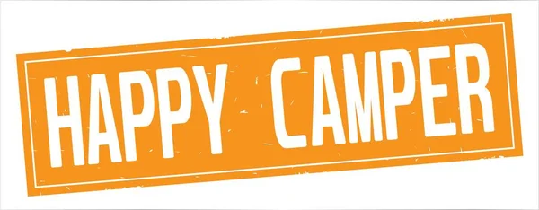 HAPPY CAMPER teksti, täydellä oranssilla suorakulmioleimalla . — kuvapankkivalokuva