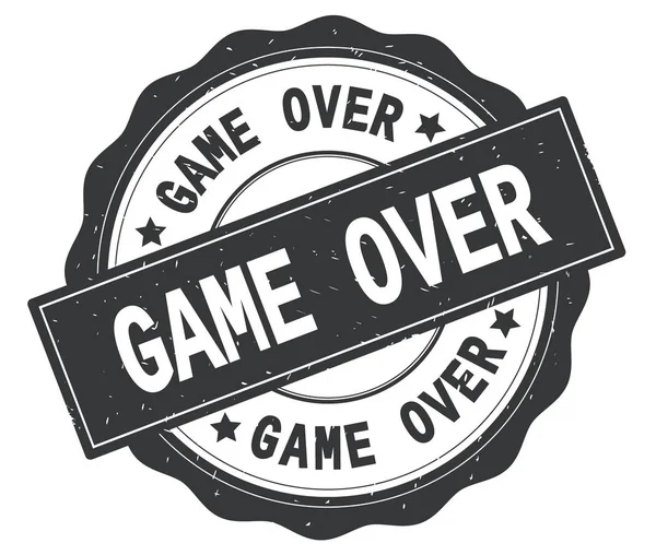 Текст GAME OVER, написанный на сером круглом значке . — стоковое фото