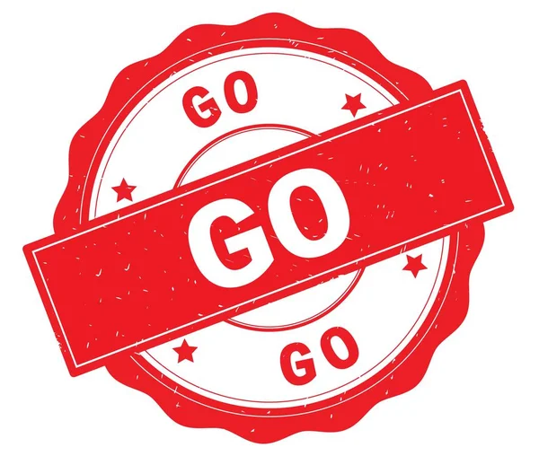 Kırmızı yuvarlak rozet yazılmış metni, git.