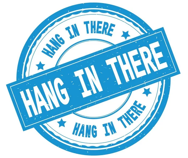 HANG IN There, texto escrito em ciano carimbo de borracha redonda . — Fotografia de Stock