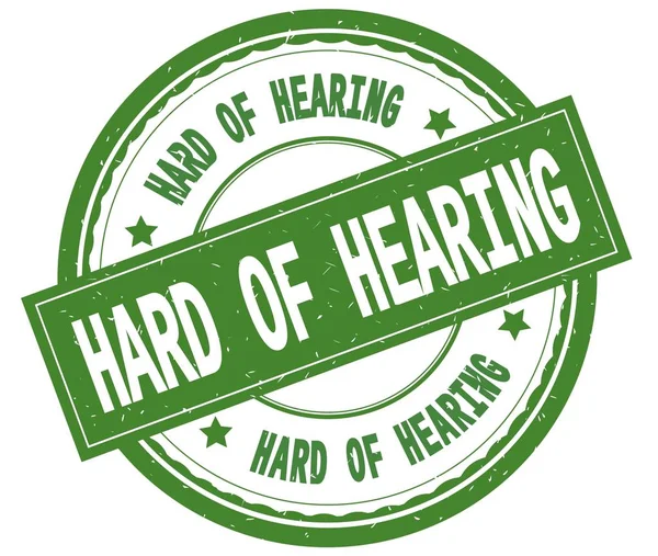 HARD OF HEARING, teks tertulis pada stempel hijau bulat . — Stok Foto