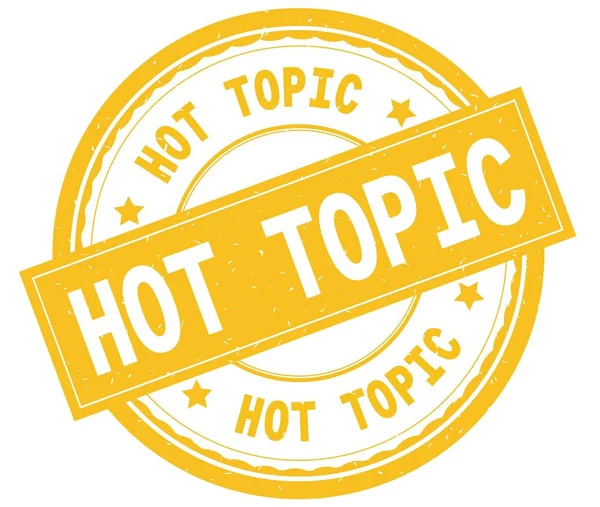 HOT TOPIC , written text on yellow round rubber stamp. — Stock Photo, Image
