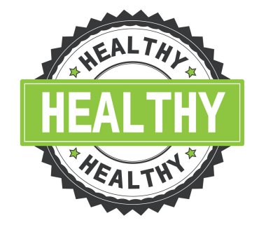 Sağlıklı gri ve yeşil yuvarlak damga, zig zag kenarlıklı metin.