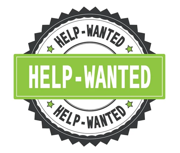 HELP WANTED testo su timbro rotondo grigio e verde, con zag bor — Foto Stock