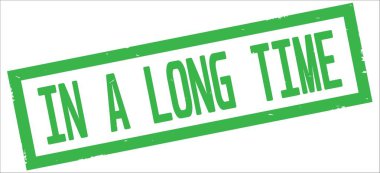 A uzun zaman metinde yeşil sınır dikdörtgen damgası işareti dokulu.