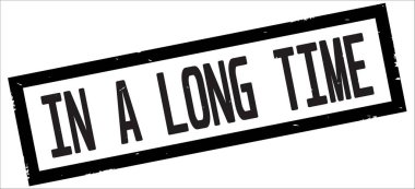 A uzun zaman metinde siyah sınır dikdörtgen damgası işareti dokulu.