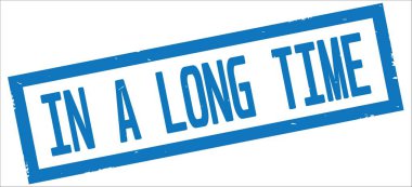 A uzun zaman metinde mavi sınır dikdörtgen damgası işareti dokulu.