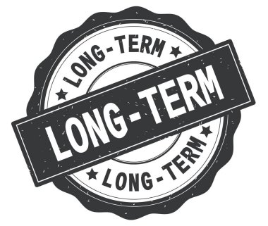 Gri yuvarlak rozet yazılı uzun vadeli metin.