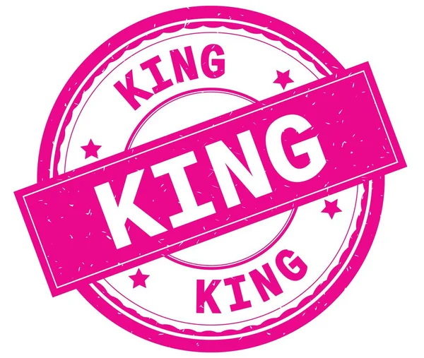 KING, written text on pink round rubber stamp . — стоковое фото