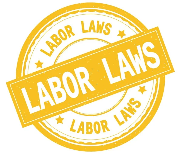 労働法、黄色のテキストを書かれたラウンド スタンプ. — ストック写真