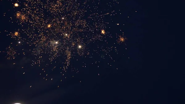 Shining fireworks with bokeh lights in the night sky. glowing fireworks show. New years eve fireworks celebration. multico lored fireworks in night sky. beautiful colored night explosions in black — Stock Photo, Image