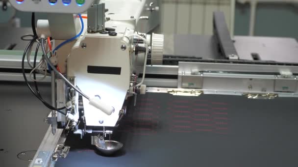 Sewing machine control computer. automatic sewing machine. Automated machine embroidery. CNC robotics works on the sewing production line. Sewing machine robot. — Stock Video