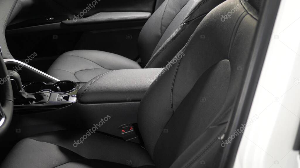 beautiful leather car interior design. luxury leather seats in the car. Black leather seat covers in the car. artificial leather rear seats in the car.