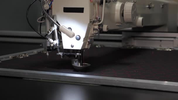 Sewing machine control computer. automatic sewing machine. Automated machine embroidery. CNC robotics works on the sewing production line. Sewing machine robot. — Stock Video